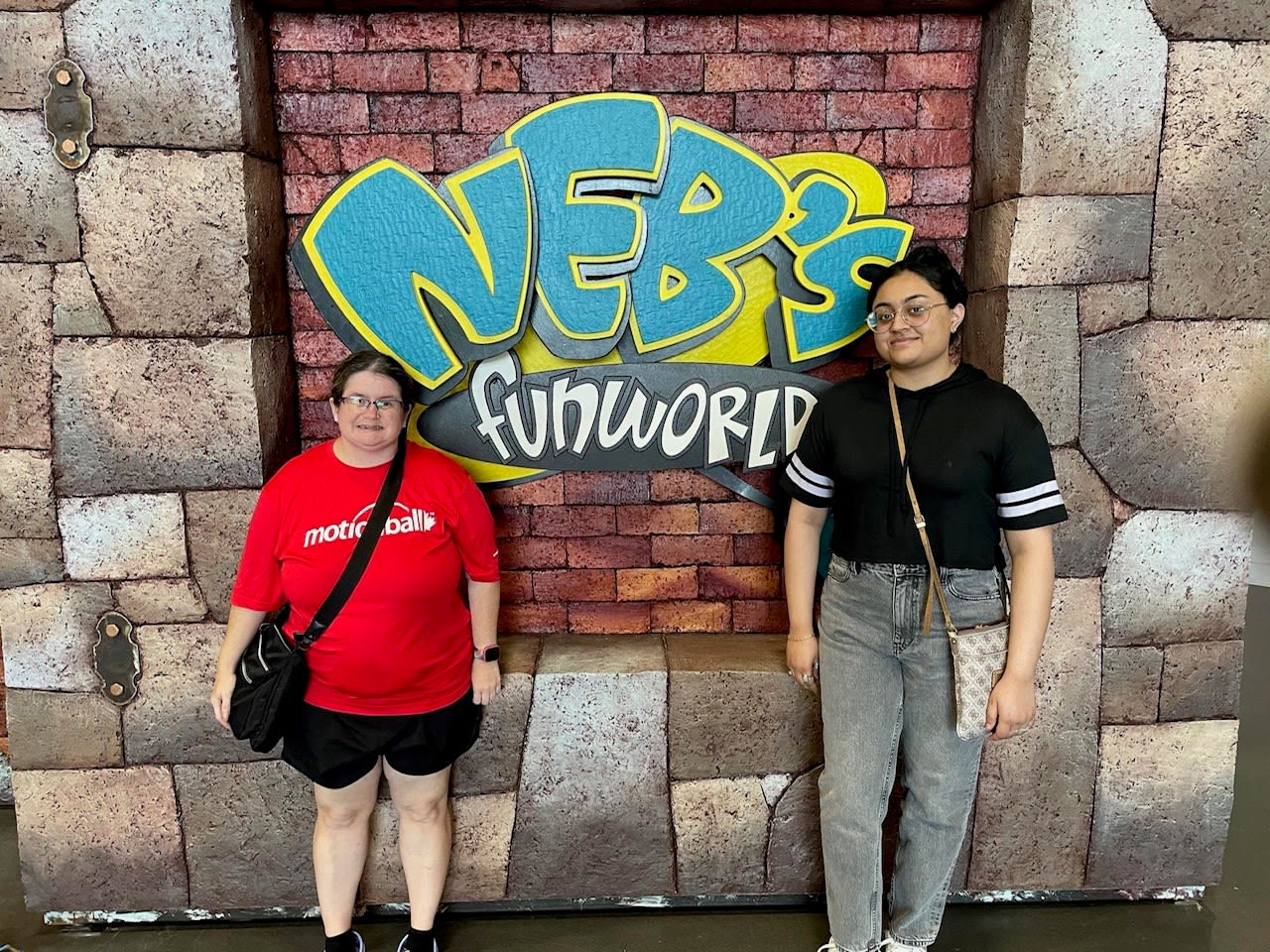 Volunteer with supported individual at Neb's Fun World